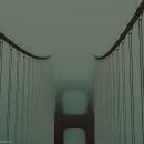 Photograph of a foggy bridge.