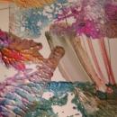 Abstract painting with leaf imprints on the dried pastel paint. 