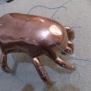 Brass crab statue with wires poking out which reveals Roger's beginning stages of this piece. 