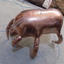 Brass crab statue with wires poking out.