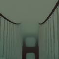 Photograph of a foggy bridge.