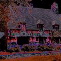 Photograph of an oversaturated cottage that makes the picture look dark.