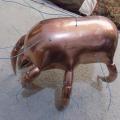Brass crab statue with wires poking out.
